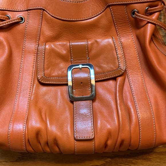 Cole Hahn orange handbag with fringe and silver hardware. - Picture 5 of 16